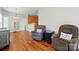 Comfortable living room features hardwood floors, recliners, and view of kitchen area at 2323 Granville Pl # A, Monroe, NC 28110