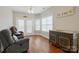 Comfortable living room features hardwood floors, windows, and comfortable seating at 2323 Granville Pl # A, Monroe, NC 28110