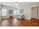 Bright living room featuring hardwood floors, neutral paint, and abundant natural light at 2323 Granville Pl # A, Monroe, NC 28110