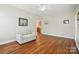 Bright living room featuring hardwood floors, neutral paint, and an open layout at 2323 Granville Pl # A, Monroe, NC 28110