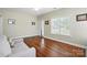 Cozy living room featuring hardwood floors, neutral paint, and abundant natural light at 2323 Granville Pl # A, Monroe, NC 28110