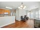 Open concept living area with hardwood floors connects to the kitchen and dining areas at 2323 Granville Pl # A, Monroe, NC 28110