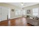 Bright living room featuring hardwood floors, neutral paint, and abundant natural light at 2323 Granville Pl # A, Monroe, NC 28110