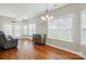 Bright living room features hardwood floors, many windows, and comfortable seating at 2323 Granville Pl # A, Monroe, NC 28110