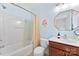 Well-lit bathroom with shower/tub combo and modern vanity at 2485 Shanklin Ln, Denver, NC 28037