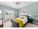 Bedroom with a window, ceiling fan and a gray upholstered bed frame at 2485 Shanklin Ln, Denver, NC 28037