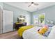 Bedroom with a window, ceiling fan and a gray upholstered bed frame at 2485 Shanklin Ln, Denver, NC 28037