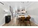 Bright dining area features modern lighting, hardwood flooring, and easy access to the kitchen at 2485 Shanklin Ln, Denver, NC 28037