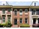Charming brick townhome featuring a black front door, well-maintained landscaping, and large windows for natural light at 2485 Shanklin Ln, Denver, NC 28037