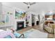 Comfortable living room with fireplace, TV, and desk area and an open floor plan at 2485 Shanklin Ln, Denver, NC 28037