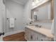 Bathroom with ornate vanity, decorative mirror, and neutral walls at 270 Kemp Rd, Mooresville, NC 28117