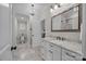 Bright bathroom featuring granite countertop, white vanity, and elegant chandelier at 270 Kemp Rd, Mooresville, NC 28117