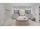 Bathroom with a large soaking tub, dual vanities, and tile flooring at 270 Kemp Rd, Mooresville, NC 28117