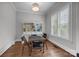 Bright breakfast nook with built-in shelving, plenty of sunlight, and hardwood floors at 270 Kemp Rd, Mooresville, NC 28117