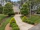 Long driveway leading to a spacious house with lush landscaping at 270 Kemp Rd, Mooresville, NC 28117