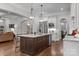 Modern kitchen with a large island, stainless steel appliances, and sleek white cabinets at 270 Kemp Rd, Mooresville, NC 28117