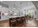 Open concept kitchen with a large island, pendant lights, and a view into the dining area at 270 Kemp Rd, Mooresville, NC 28117