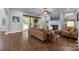 Inviting living room features hardwood floors, fireplace, and sliding glass doors to the outdoors at 270 Kemp Rd, Mooresville, NC 28117
