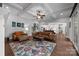 Spacious living room with hardwood floors, coffered ceilings, and open access to kitchen at 270 Kemp Rd, Mooresville, NC 28117