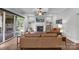 Open-concept living room with fireplace, hardwood floors, and access to an outdoor deck at 270 Kemp Rd, Mooresville, NC 28117