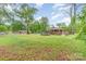 Expansive backyard featuring lush greenery, mature trees, and a home in the background at 2885 Wright Ave, Salisbury, NC 28147