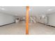 Large basement space with wood-look flooring and a wooden support beam at 2885 Wright Ave, Salisbury, NC 28147