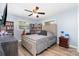 Well-lit bedroom with wood-look flooring, gray walls, and bookshelves at 2885 Wright Ave, Salisbury, NC 28147