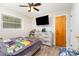 Comfortable bedroom featuring a ceiling fan, wood-look floors, and a dresser with a TV at 2885 Wright Ave, Salisbury, NC 28147