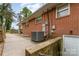 Exterior brick with concrete patio, HVAC system, and utility connections at 2885 Wright Ave, Salisbury, NC 28147
