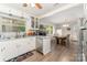 Bright kitchen featuring white cabinetry, stainless steel appliances, and wood-look flooring at 2885 Wright Ave, Salisbury, NC 28147