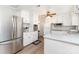 Bright kitchen with stainless steel refrigerator, white cabinets, and ample counter space at 2885 Wright Ave, Salisbury, NC 28147
