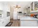 Well-lit kitchen with white cabinetry, modern appliances, and spacious countertops with wood-look flooring at 2885 Wright Ave, Salisbury, NC 28147