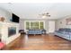 Inviting living room featuring a brick fireplace, hardwood floors, and ample natural light at 2885 Wright Ave, Salisbury, NC 28147