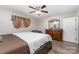 Comfortable main bedroom featuring wood-look floors, ceiling fan, and ample natural light at 2885 Wright Ave, Salisbury, NC 28147
