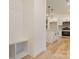 Bright kitchen features a center island, stainless steel appliances and sleek white cabinetry at 318 Sixth St, Belmont, NC 28012