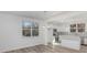 Bright dining space with view of the kitchen, featuring white cabinets, stainless appliances, and island at 318 Sixth St, Belmont, NC 28012