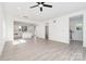 Bright, open-concept living space and open floorplan, with access to the kitchen, bathroom and stairs at 318 Sixth St, Belmont, NC 28012