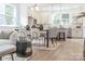 Cozy, open-concept living space and kitchen featuring modern light fixtures and light hardwood floors at 318 Sixth St, Belmont, NC 28012