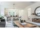 Open-concept living space, showing the light fixtures and view of the kitchen and bathroom at 318 Sixth St, Belmont, NC 28012