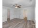 Main bedroom with 2 doors, a ceiling fan and vinyl flooring at 318 Sixth St, Belmont, NC 28012