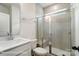 Modern bathroom with glass shower, white vanity, commode, and neutral tile for a spa-like experience at 3229 Bozeman Ct # 13, Stanley, NC 28164