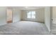 Light-filled bedroom with a large window, plush carpeting, and a walk-in closet for ample storage at 3229 Bozeman Ct # 13, Stanley, NC 28164