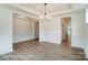 Dining room with wood floors and elegant chandelier at 3229 Bozeman Ct # 13, Stanley, NC 28164