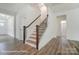 Welcoming foyer with hardwood floors, staircase, and white trim, creating an inviting entrance to the home at 3229 Bozeman Ct # 13, Stanley, NC 28164