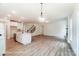 Open living space with kitchen island, stainless appliances, and fireplace at 3229 Bozeman Ct # 13, Stanley, NC 28164