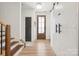 Bright foyer with hardwood floors, barn doors, and stairs to the second level at 324 Elm St, Belmont, NC 28012