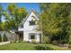 Charming two-story home with a well-kept lawn, framed by mature trees at 324 Elm St, Belmont, NC 28012