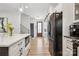 Modern kitchen showcasing a quartz island, stainless appliances, and white cabinets at 324 Elm St, Belmont, NC 28012