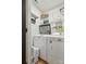 Efficient laundry room featuring white appliances and ample storage with wire shelving at 324 Elm St, Belmont, NC 28012