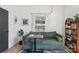 Inviting living room showcasing a sofa and side table with plants and bright natural light at 324 Elm St, Belmont, NC 28012